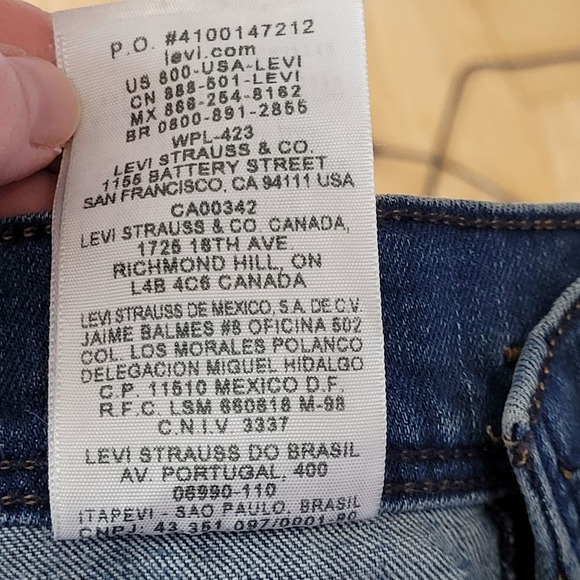 Levi's Distressed Medium Wash High Rise Demin Shorts - Picture 6 of 9